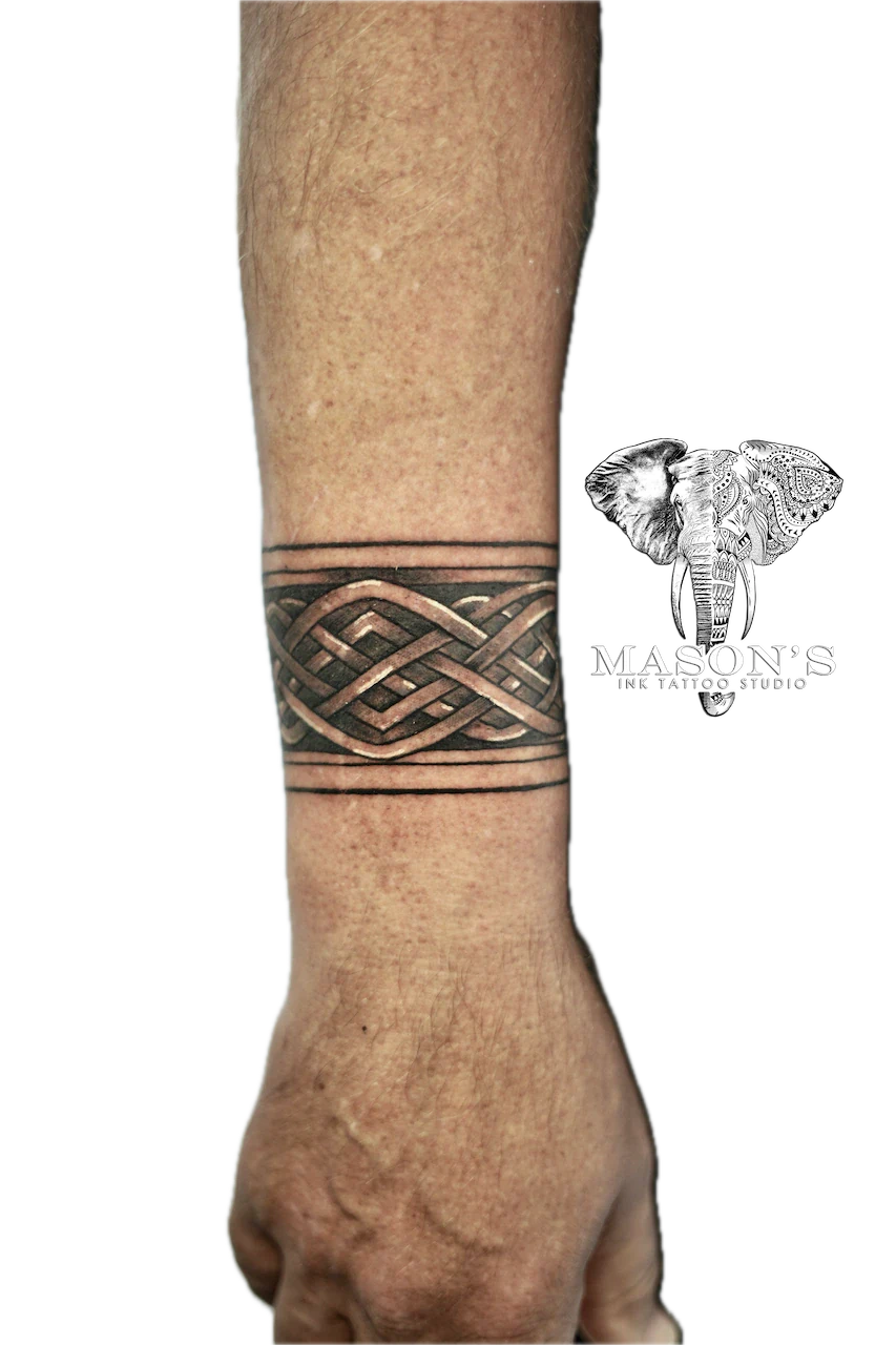 Tribal Tattoo Design: a small black and grey geometric knot pattern on the wrist
