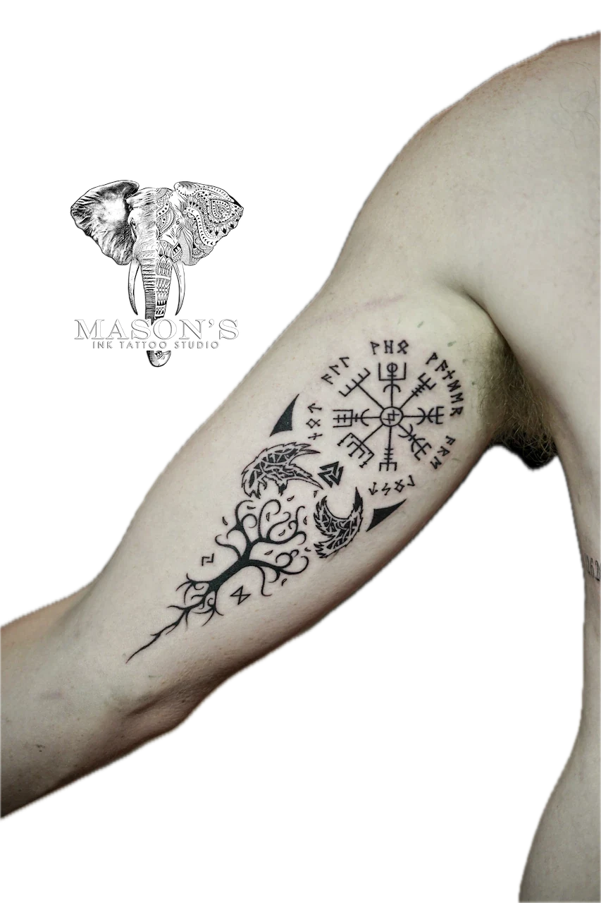 Tribal Tattoo Design: a tree with a bird and compass on a forearm