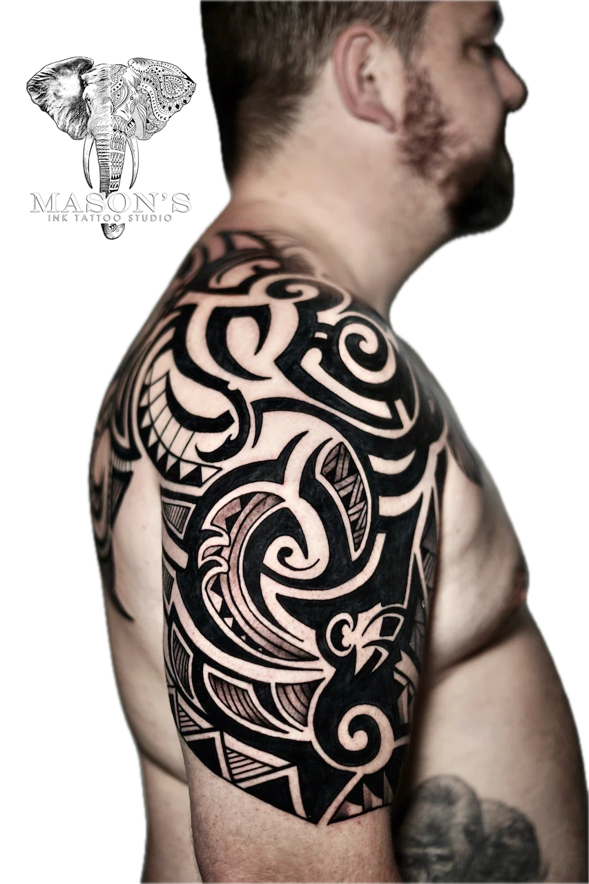 Tribal Tattoo Design: a large black and grey geometric pattern on the upper arm