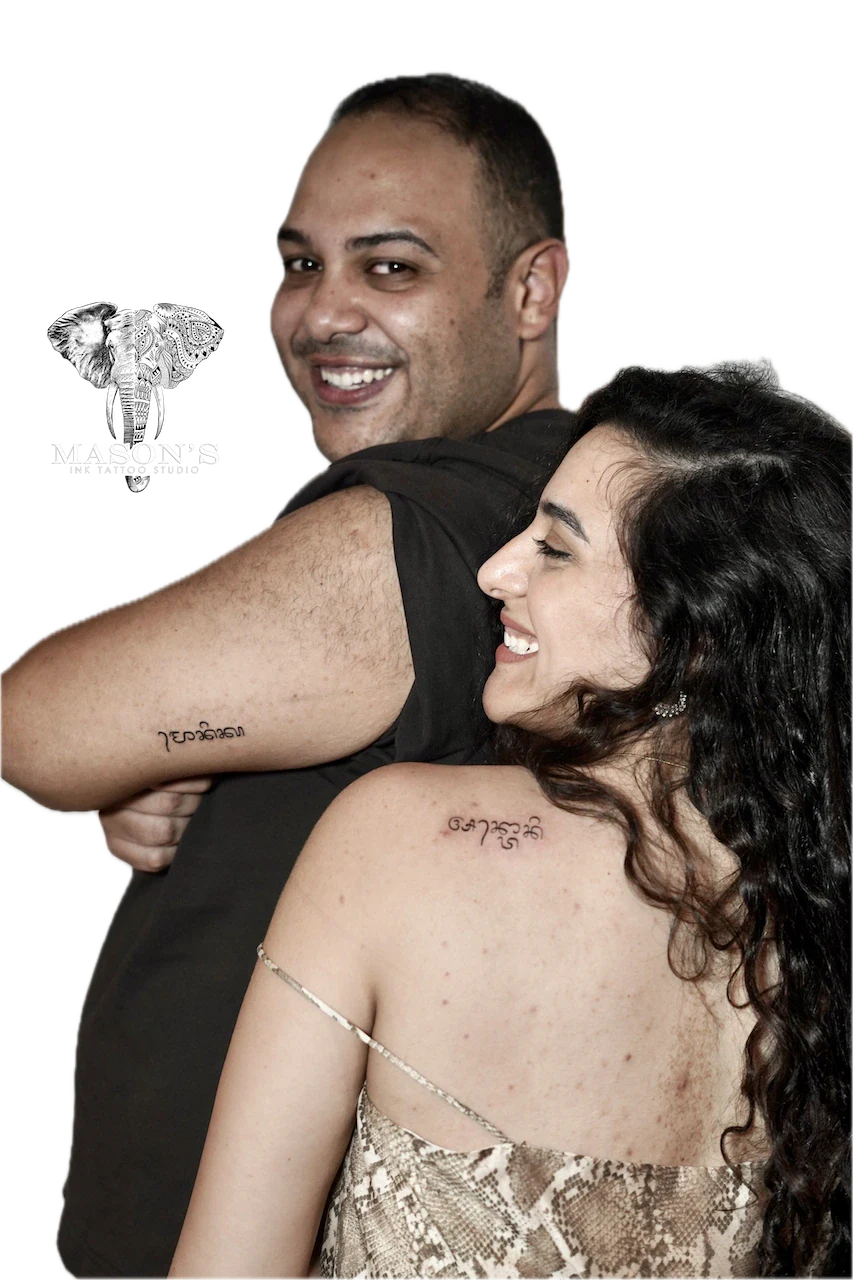 Fine Line Om Couple Script Tattoo Design - custom tattoo by Mason's Ink Tattoo Studio, Bali